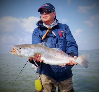 Arey serves as an instructor and tagger for the Virginia Game Fish Tagging Program. Here he is with one of his favorite angling targets, a speckled trout. © VMRC.